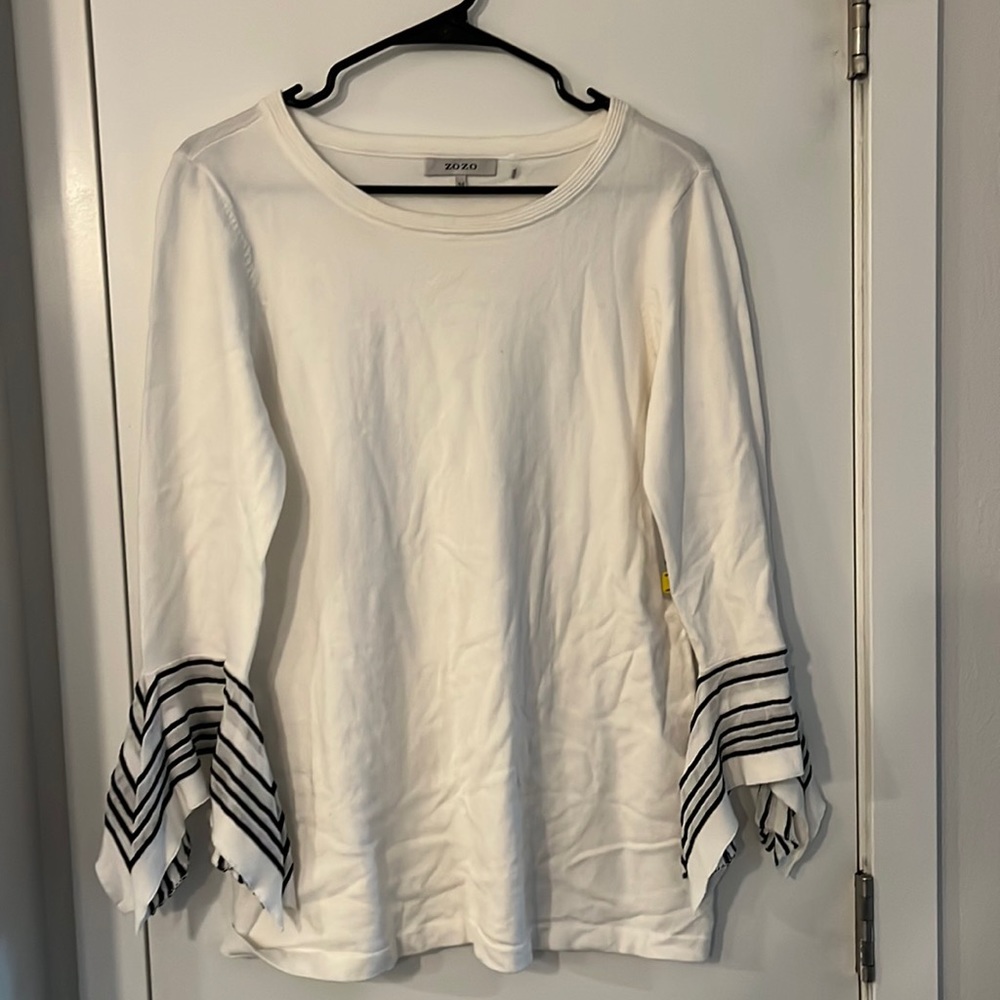 This blouse still has tags on it! Never worn